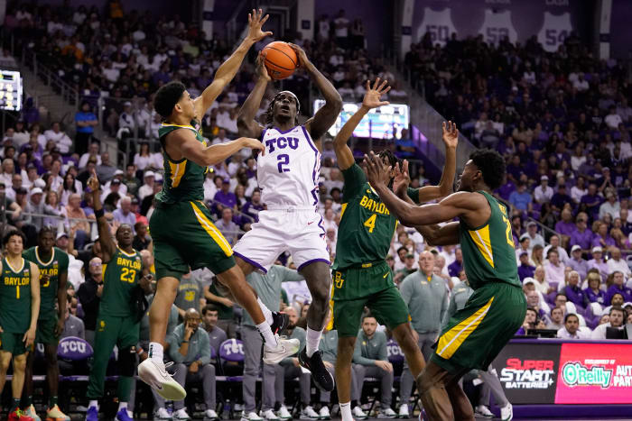 Feb 26, 2024; Fort Worth, Texas, USA; TCU Horned Frogs forward Emanuel Miller (2) drives to the basket on Baylor Bears guard RayJ Dennis (10) and guard Ja'Kobe Walter (4) during the first half at Ed and Rae Schollmaier Arena.